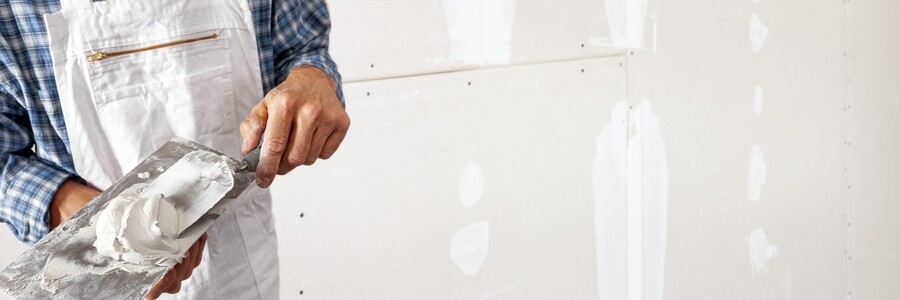 Drywall repair being performed by an experienced Menjivar's Painting drywall technician.