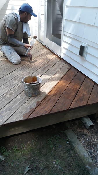 Railings of wood deck stained brown.